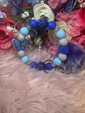 Flutters serine wristlet